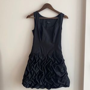 Black above knee dress.